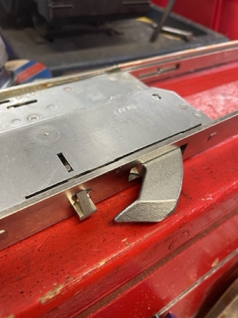 Worn UPVC gearbox removed from door during multipoint mechanism replacement Kensington