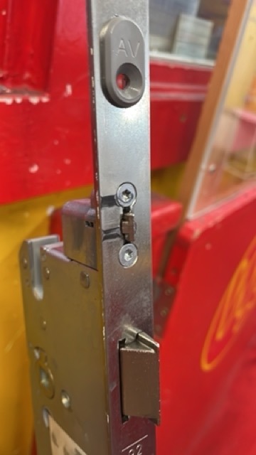UPVC multipoint lock mechanism visible inside door edge showing gearbox fault